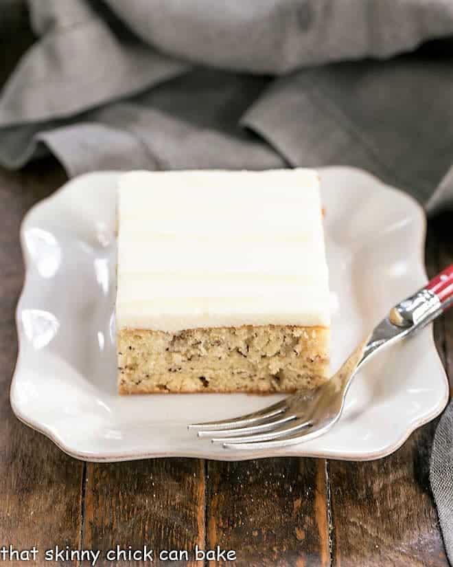 Sour Cream Banana Cake on square ceramic plate.