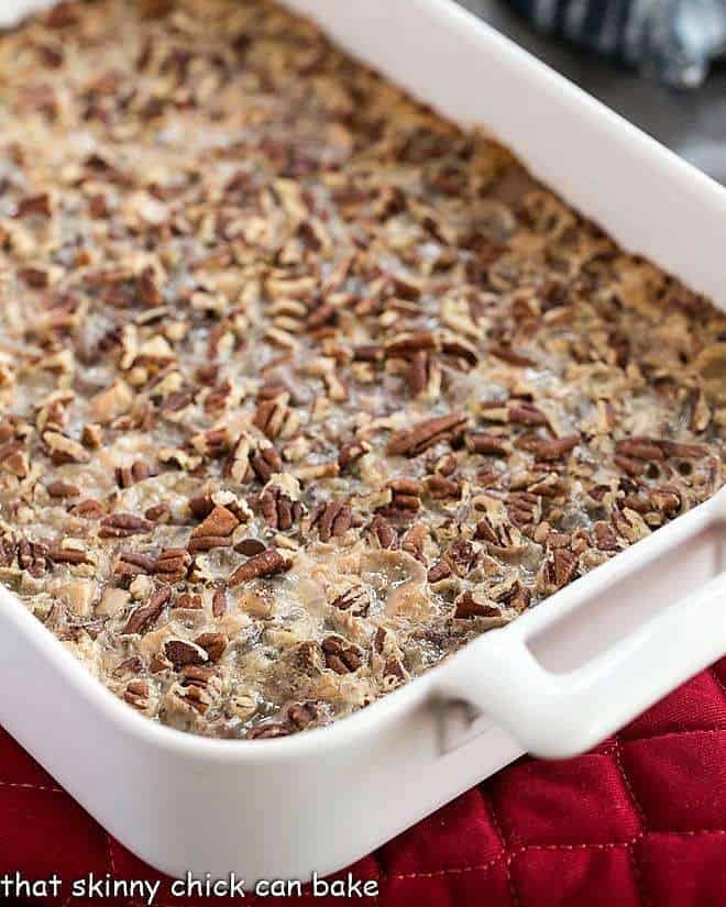 Toffee Caramel Magic Cookie Bars in a ceramic baking dish.