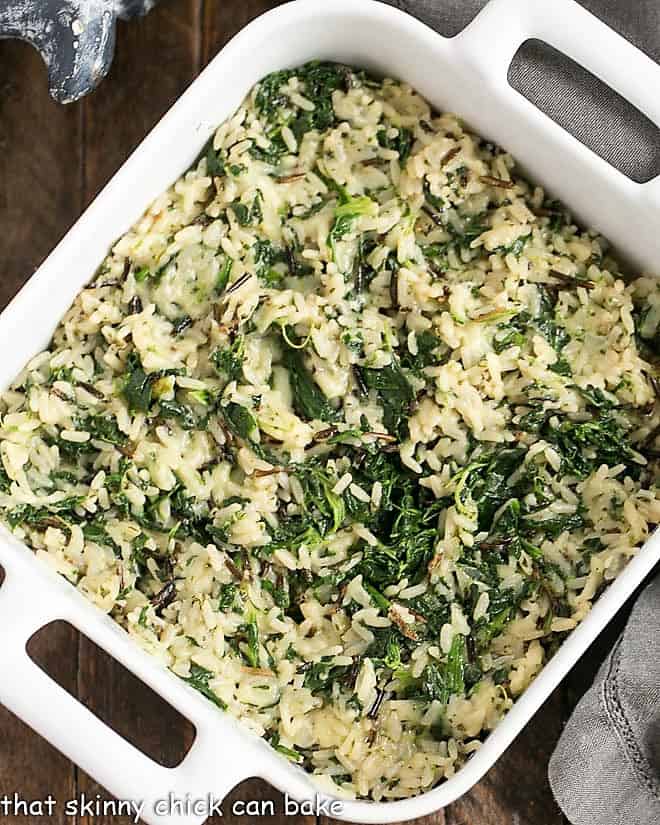 Unbaked Cheesy Spinach Rice Casserole in a ceramic dish.