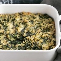 Cheesy Spinach Rice Casserole baked in a square casserole dish