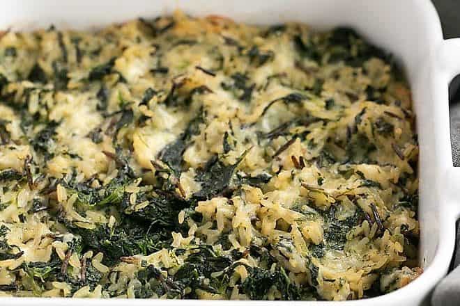 Cheesy Spinach Rice Casserole baked in a square casserole dish