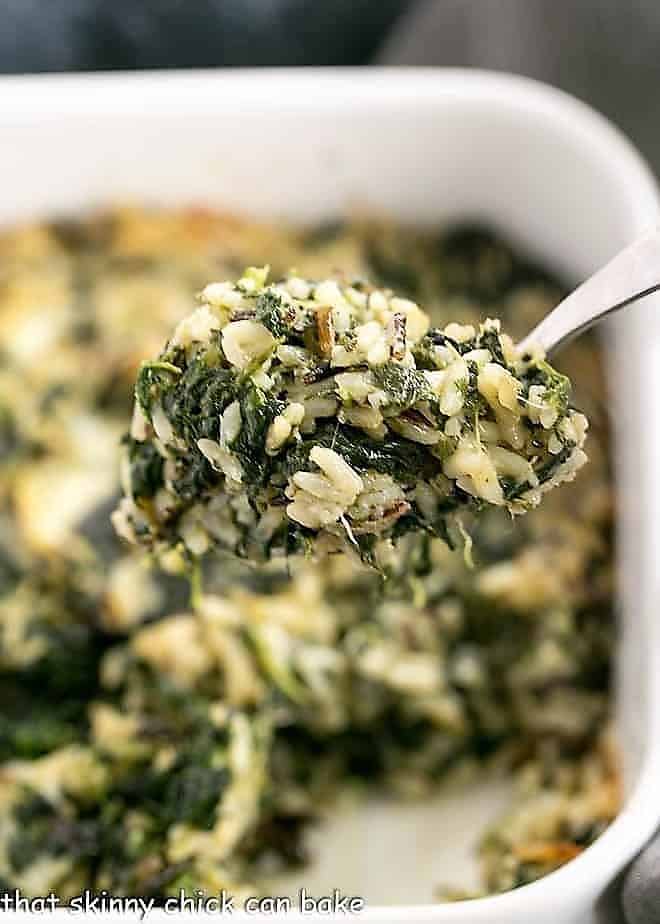 A spoonful of Cheesy Spinach Rice Casserole