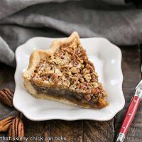 Classic Pecan Pie slice with a red handled fork
