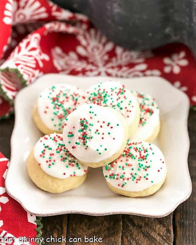Frosted Italian Ricotta Cookies on a square white plate.