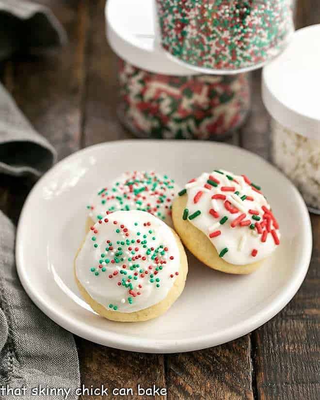 3 Italian Ricotta Cookies on a round white plate.