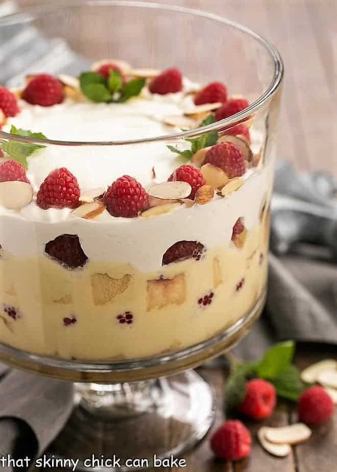 Traditional English Trifle side view in a glass trifle bowl.