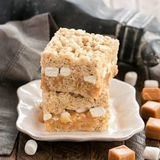 2 Caramel Stuffed Rice Krispie Treats on a square white plate