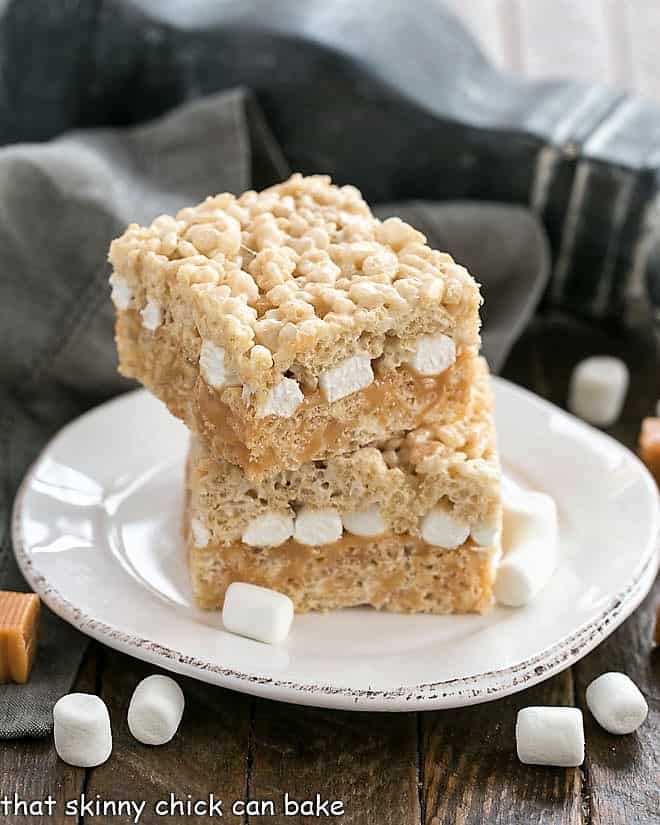 Caramel Stuffed Rice Krispie Treats on a round dessert plate.