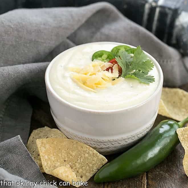 Easy homemade queso dip in a small white bowl