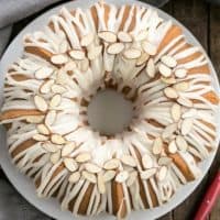 Easy Almond Bundt Cake with Amaretto Glaze on a white plate from above