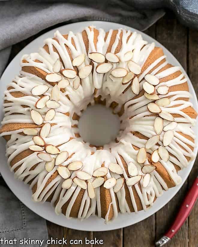 Easy Almond Bundt Cake with Amaretto Glaze on a white plate from above.