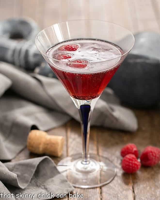 Classic Kir Royale with Cassis in a blue stem martini glass.