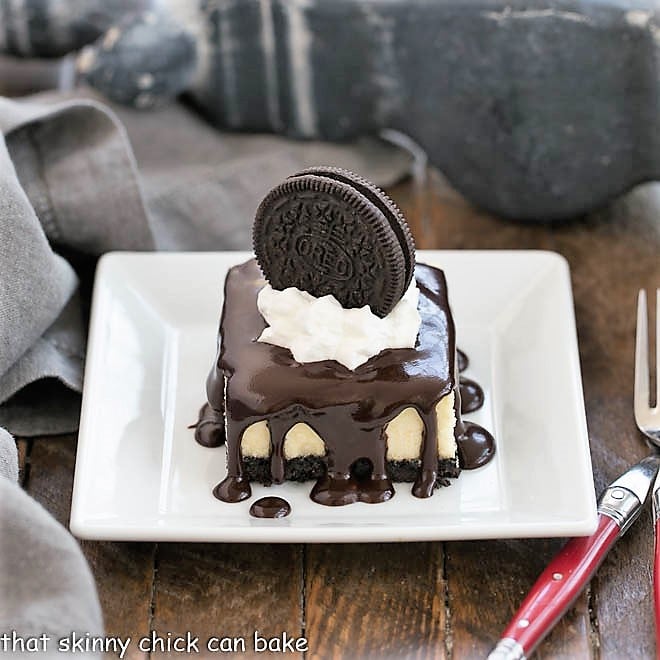 Hot Fudge Cheesecake Bars on a small white plate