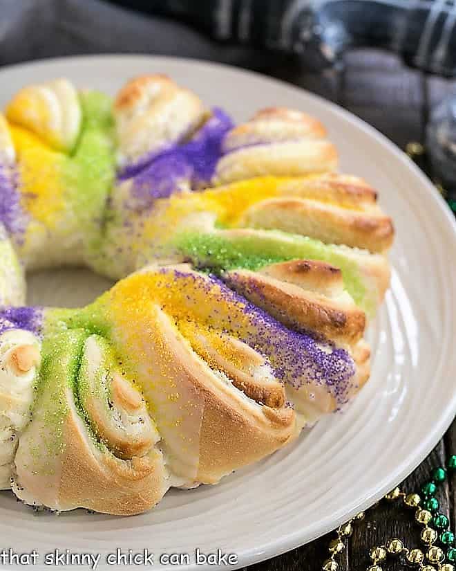 Easy King Cake with cream cheese filling on a white plate.