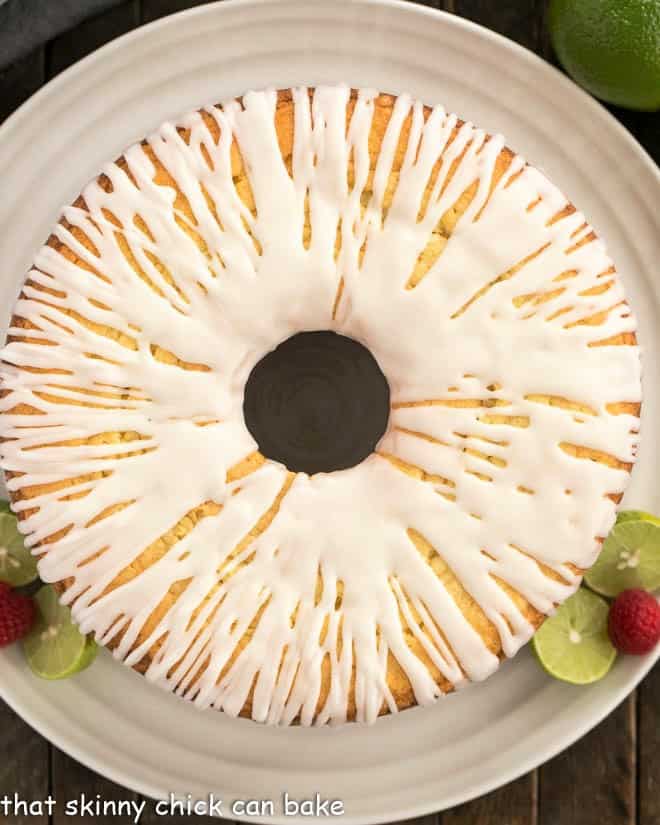 Overhead view of key lime pound cake on a white serving plate.