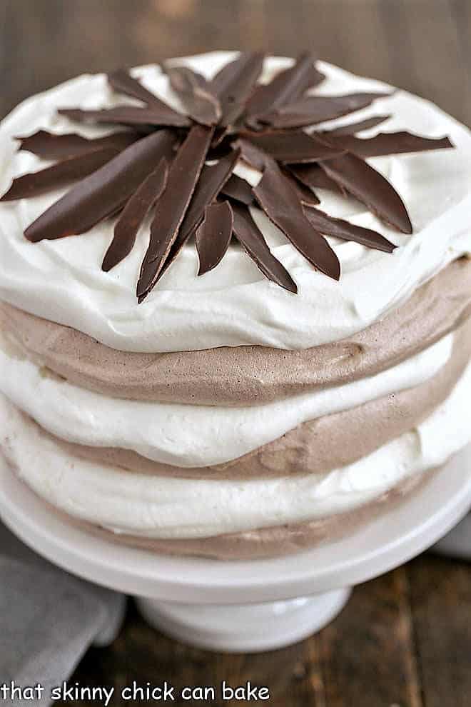 Close view of layered chocolate meringue cake.