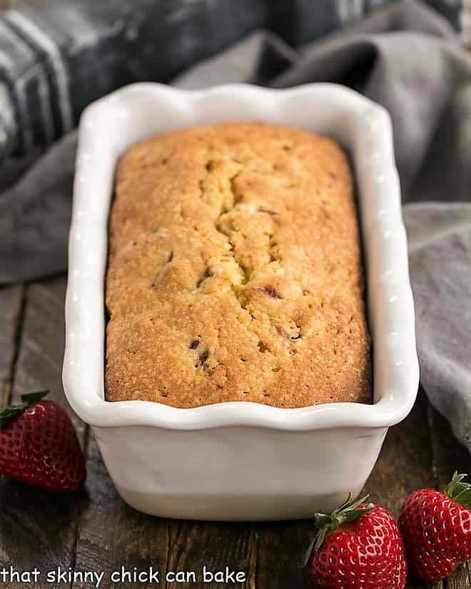  Fresh Strawberry Pound Cake in a white ceramic loaf pan.