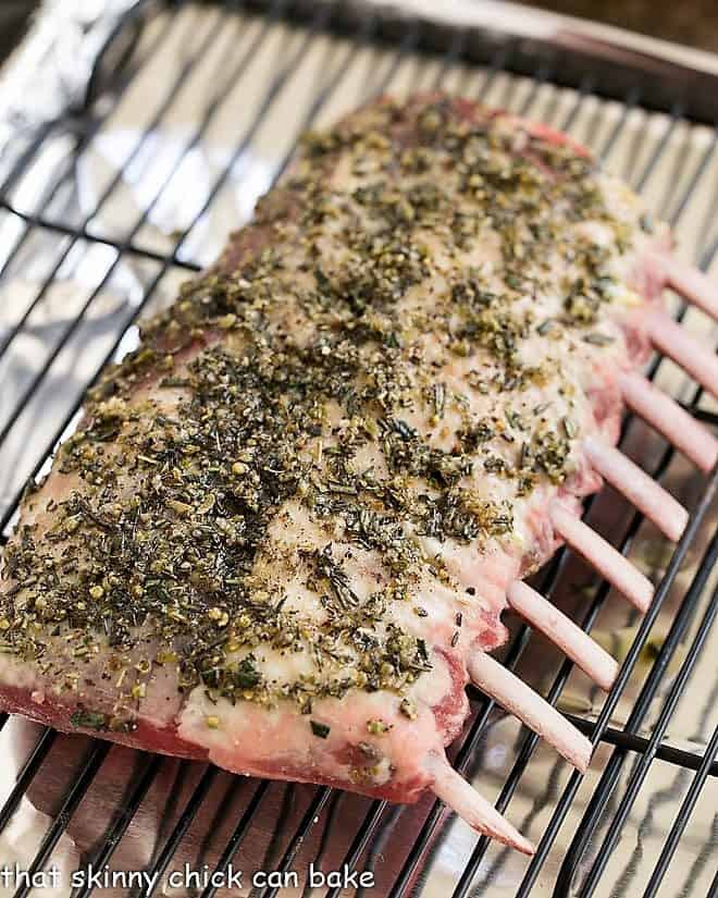 Herb Crusted Rack of Lamb marinating on a wire rack