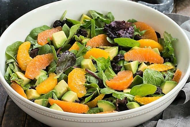 Cherry Orange Salad with Citrus Vinaigrette in a white ceramic serving bowl