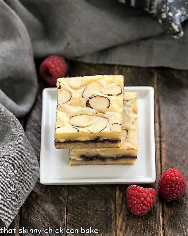 Raspberry Filled White Chocolate Bars stacked on a square white plate