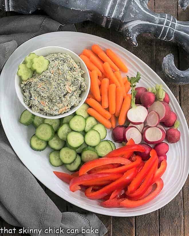 Sour Cream Spinach Dip on an oval white vegetable platter
