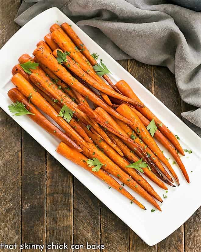 Overhead view of Honey Balsamic Roasted Carrots on a white platter.