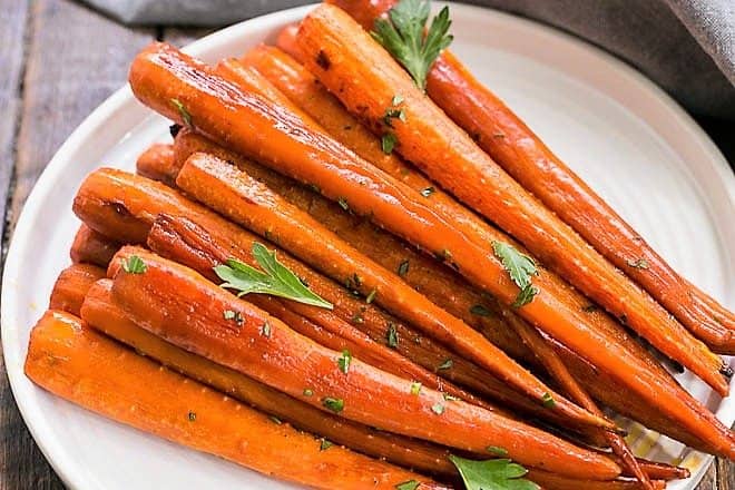 Honey Balsamic Roasted Carrots on a round, white ceramic plate