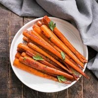 Honey Balsamic Roasted Carrots on a white ceramic plage