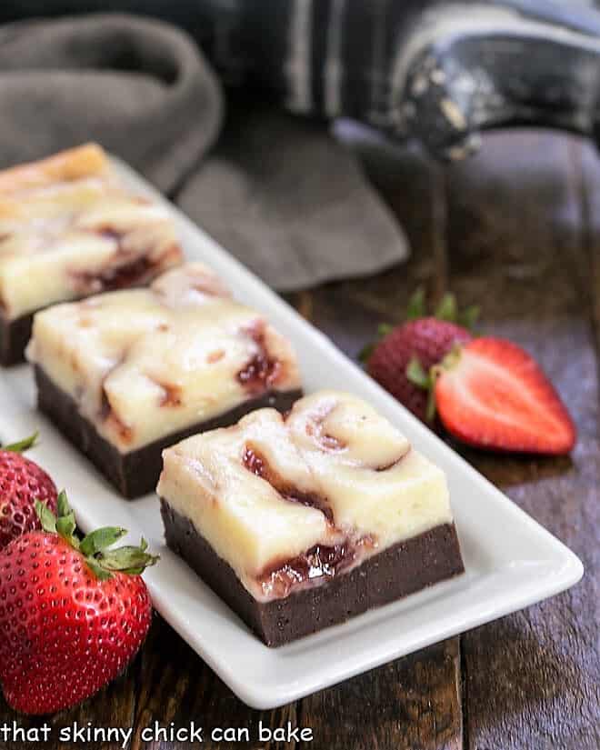 Strawberry Cheesecake Brownies on a rectangular white tray