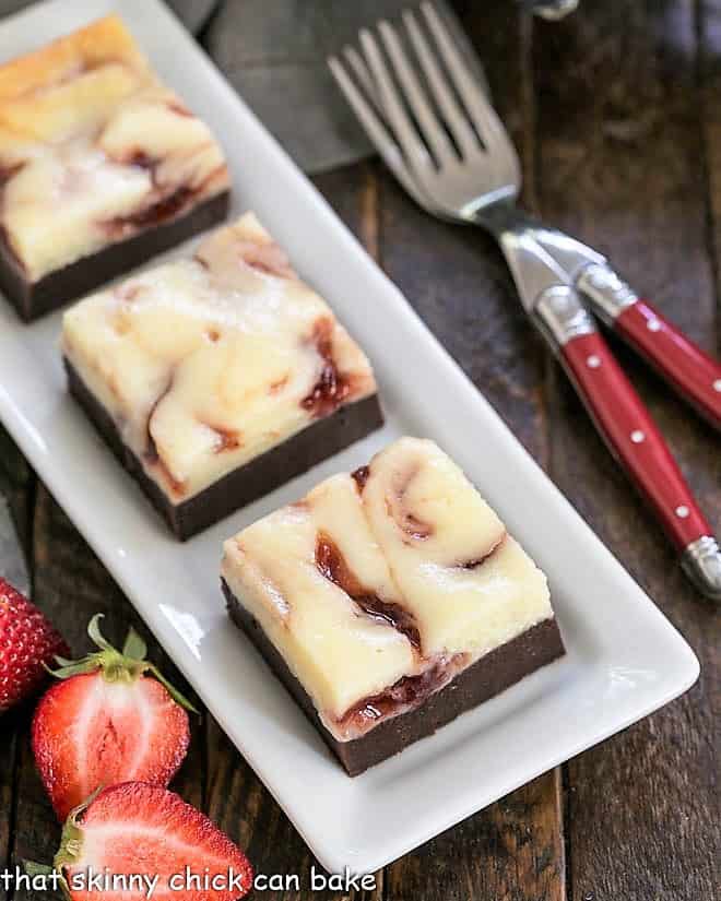 Overhead view of Strawberry brownies on a white tray