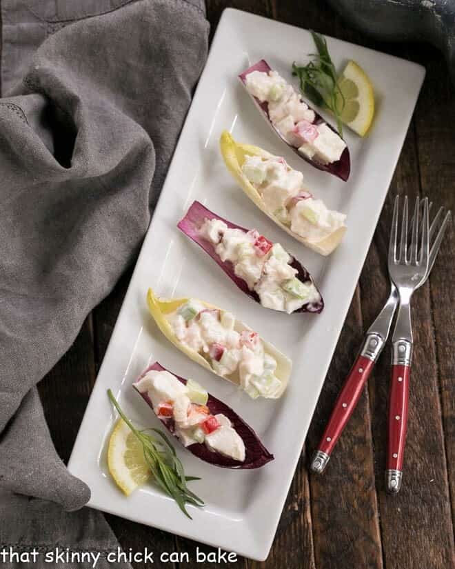 Overhead view of Lobster Salad in Endive Cups on a white rectangular tray