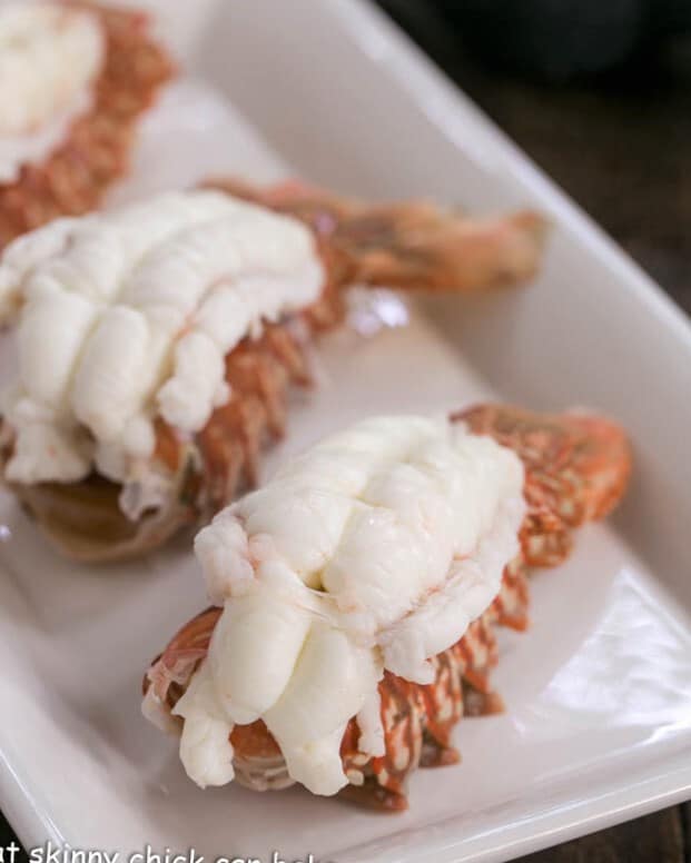 Cooked lobster tails on a white tray