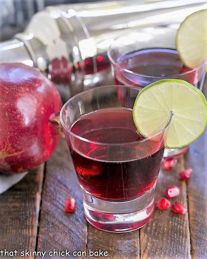 Two Pomegranate Cosmopolitan Cocktails in high ball glasses.