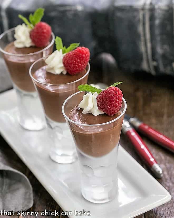 Blender Chocolate Mousse in cordial glasses on a white tray.