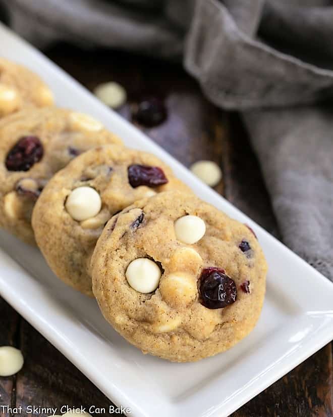 Cranberry White Chocolate Cookies on a white ceramic tray.