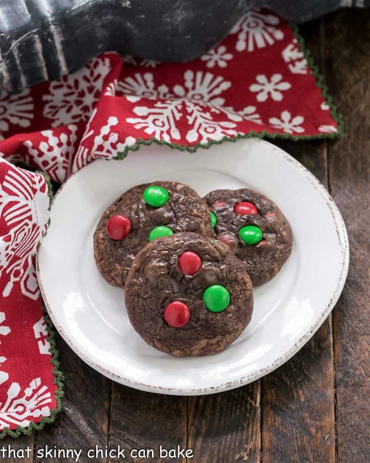 Overhead view of 3 truffle cookies on a small white plate