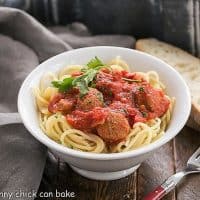 Pasta Sauce Recipe with Sausage in a white bowl with a red handled fork