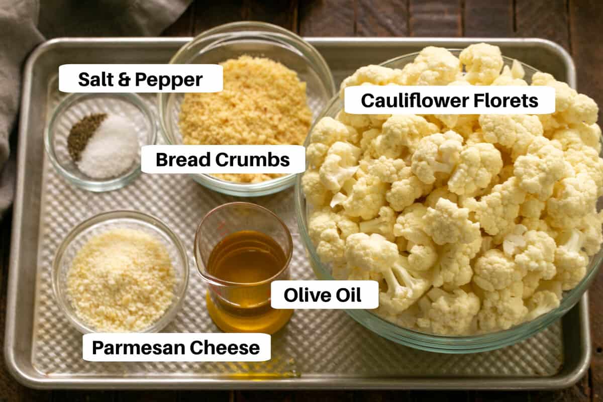 Overhead view of roasted cauliflower ingredients with labels on a sheetpan.