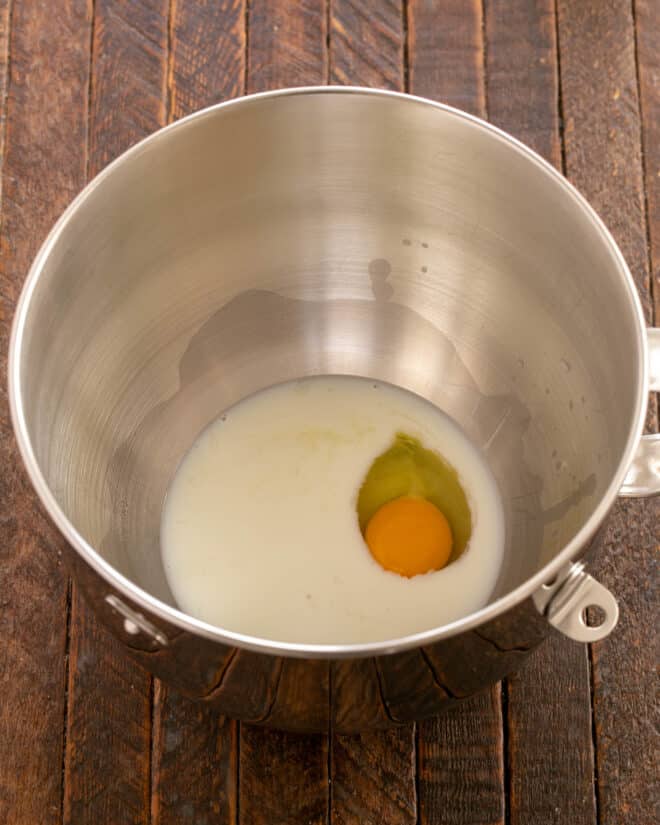 Milk, butter and egg added to bowl.