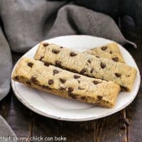 3 chocolate chip cookie sticks on a small white plate