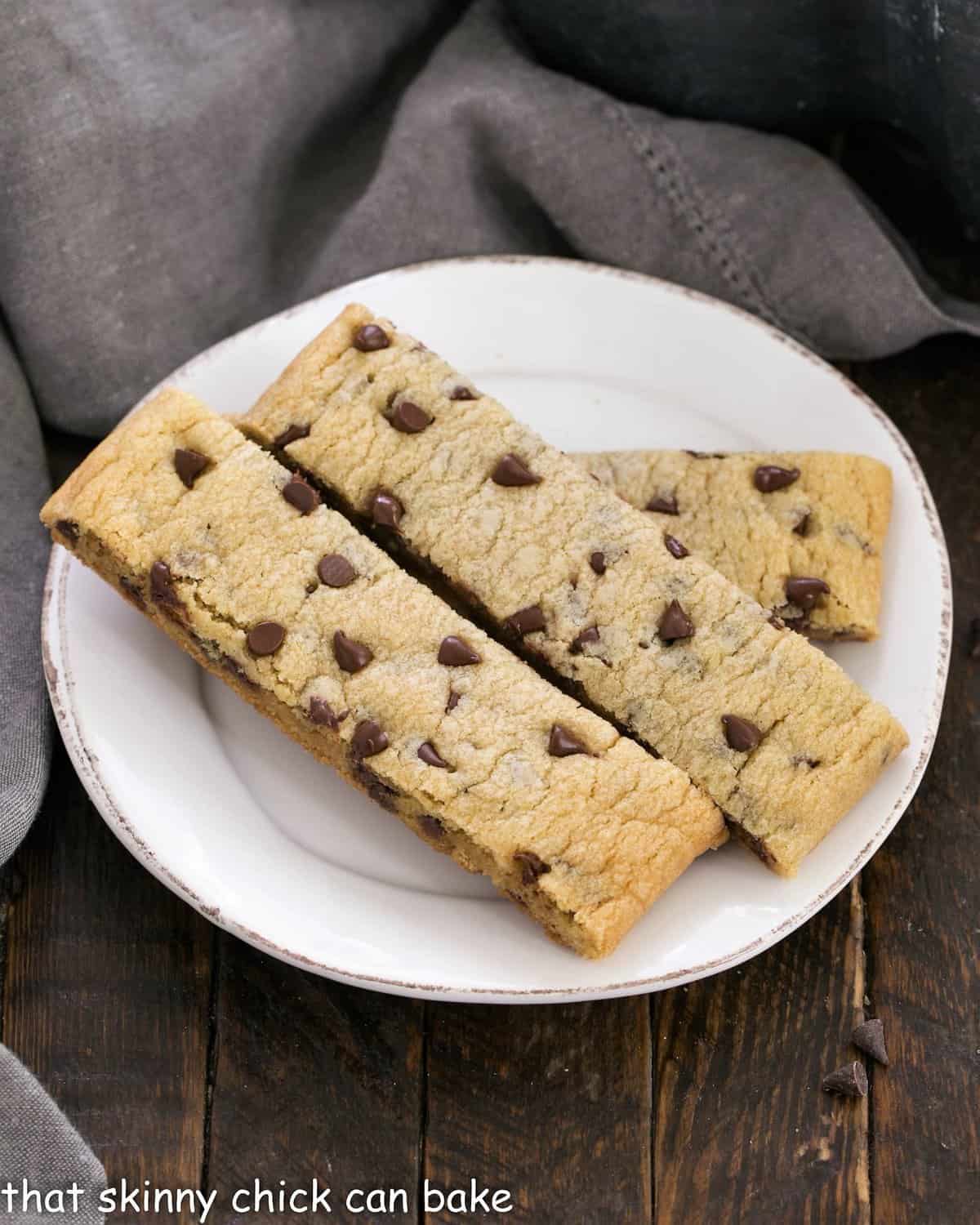 Chocolate chip cookie dippers on a small white ceramic plate.