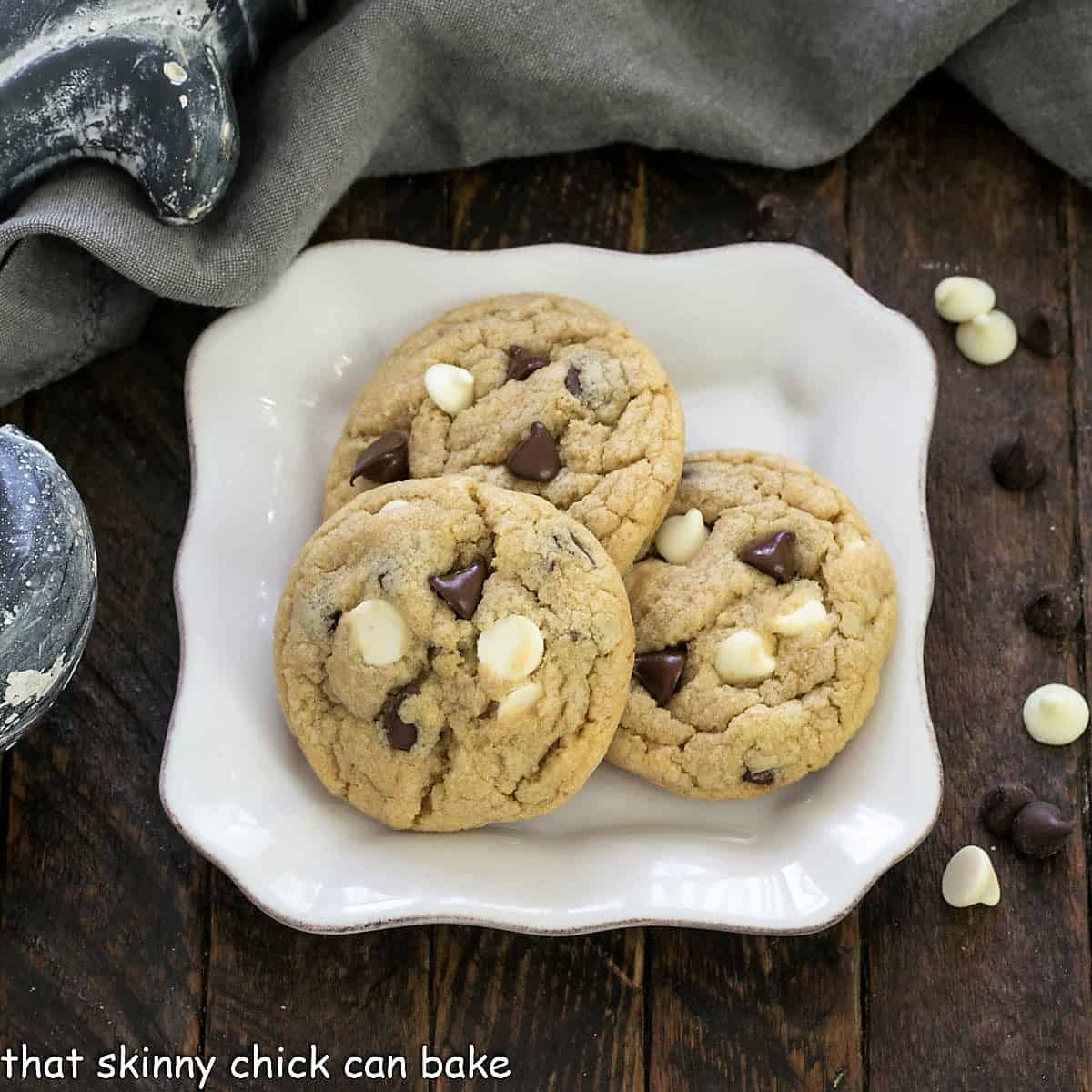 Overhead view of 3 pudding cookies on a square dessert plate.