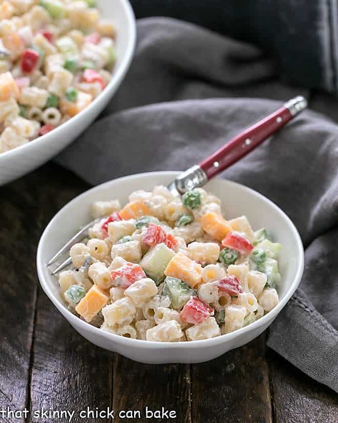 Easy pasta salad recipe in a small white bow with a red handled fork