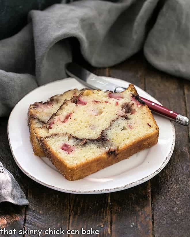 2 slices of rhubarb bread on a round white plate.