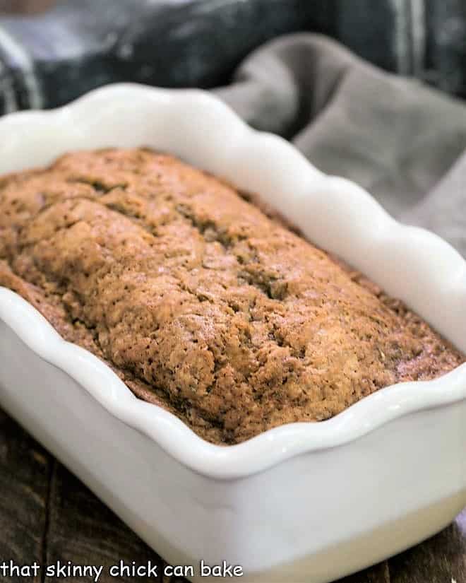 Loaf of Cinnamon Spiced Zucchini Bread Recipe in a white loaf pan