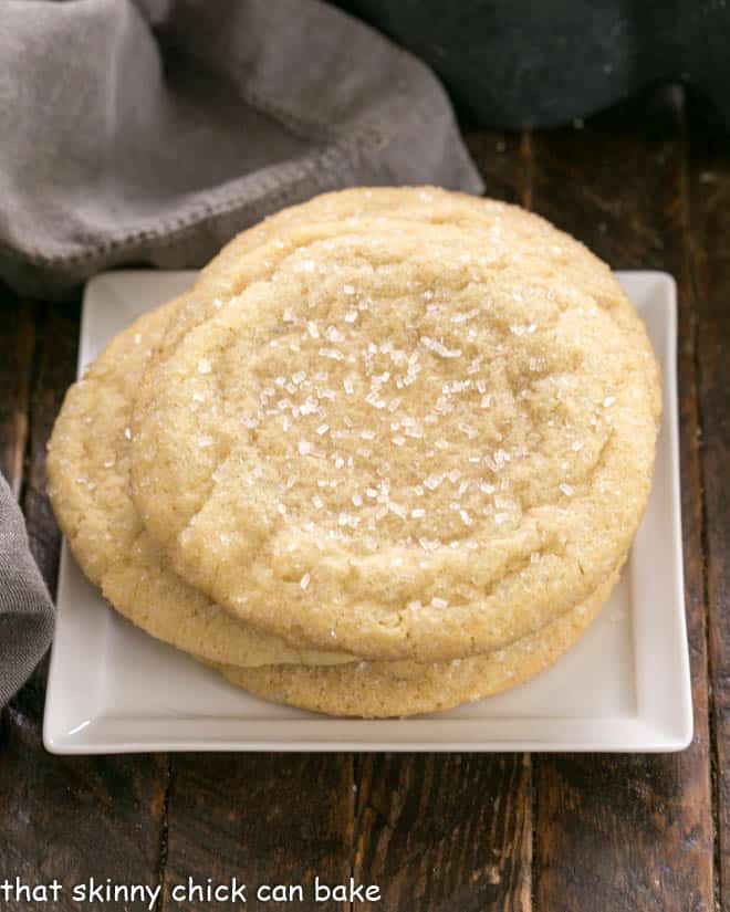 Overhead view of a stack of Big Homemade Sugar Cookies on a square white plate.