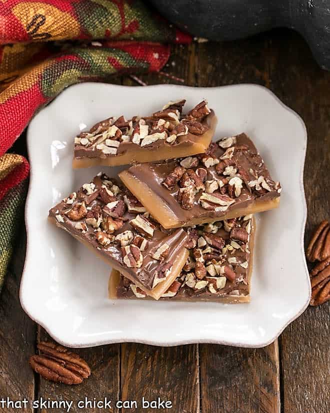 Best Recipe for Toffee - This Christmas Candy Recipe is a must make for the holidays! Overhead view of Classic English Toffee on a square white plate.