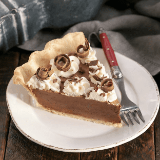 Frangelico French Silk Pie on a white plate with a red handled fork