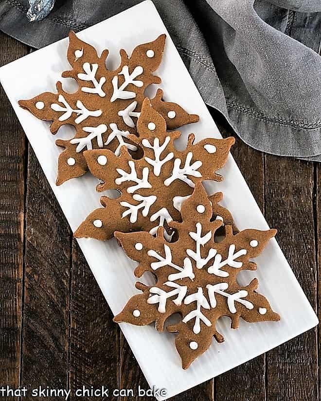 Overhead view of 3 gingerbread snow flakes.