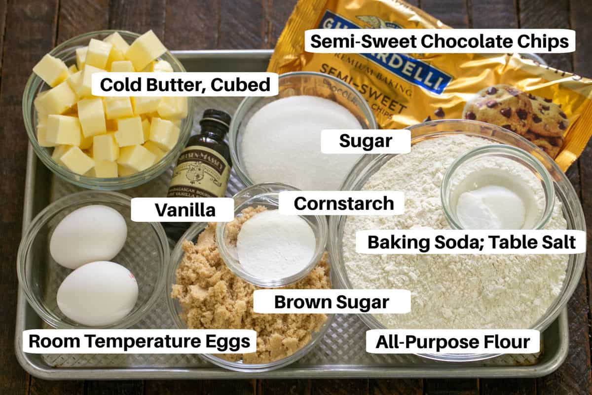 Levain chocolate chip cookie ingredients with labels on a metal sheetpan.